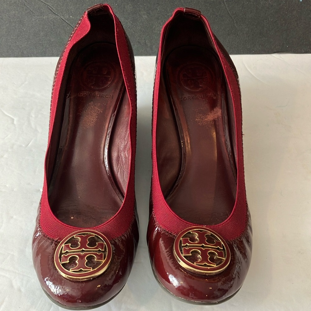 Preowned Tory Burch well worn burgundy wedge heels. No size on shoes. 8/8.5